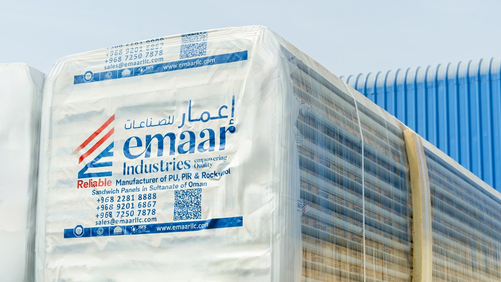 Export packaged and stacked Emaar sandwich panel bundles staged for international dispatch